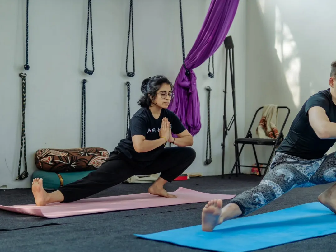 Students practising inversions with support