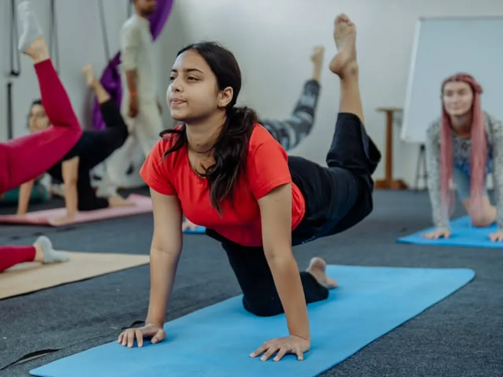 Students practising asana during the 200 hour yoga teacher training in Rishikesh