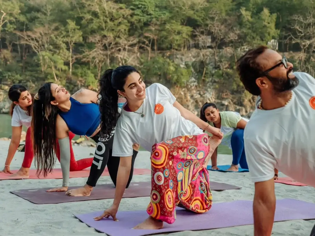 200 Hour Yoga Teacher Training students practising beside the Ganga in Rishikesh