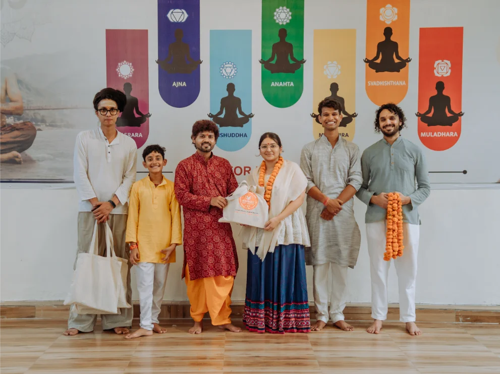 Closing ceremony for a teacher training group in the yoga hall at Rishikesh Yog Kendra