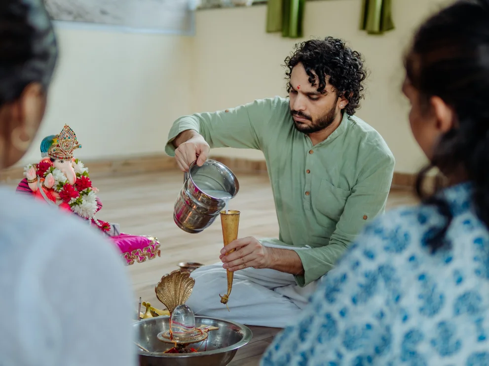 Abhishek offering poured over the shivling during a ceremony