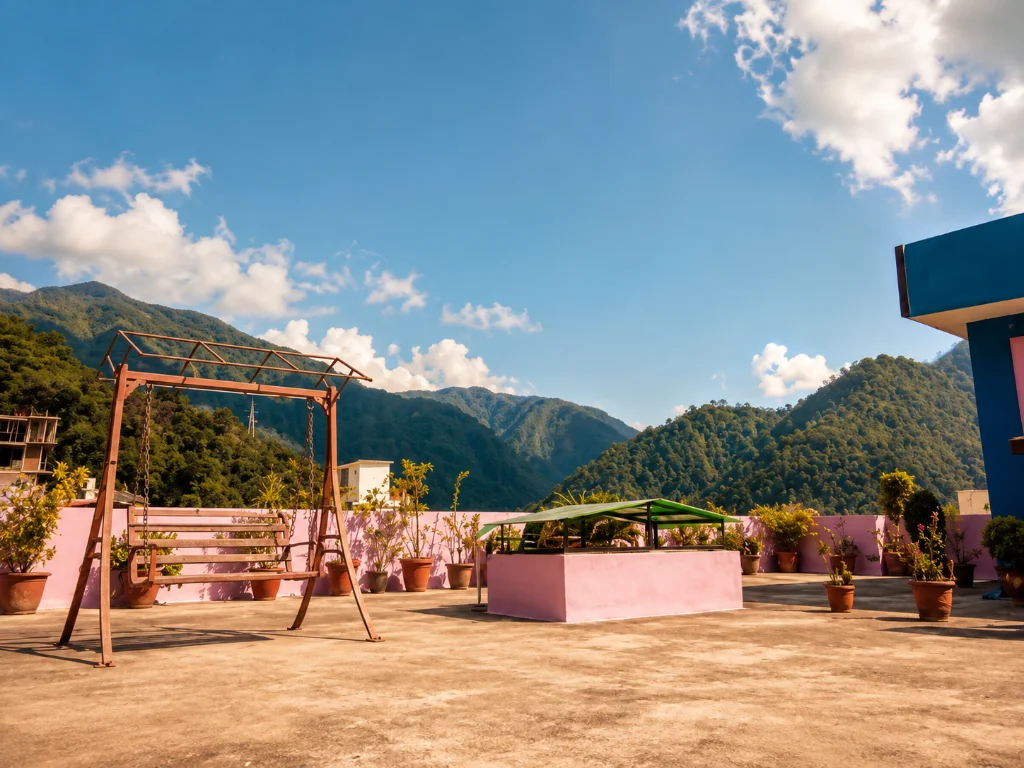 Rooftop terrace with a swing seat and a view of the forested hills