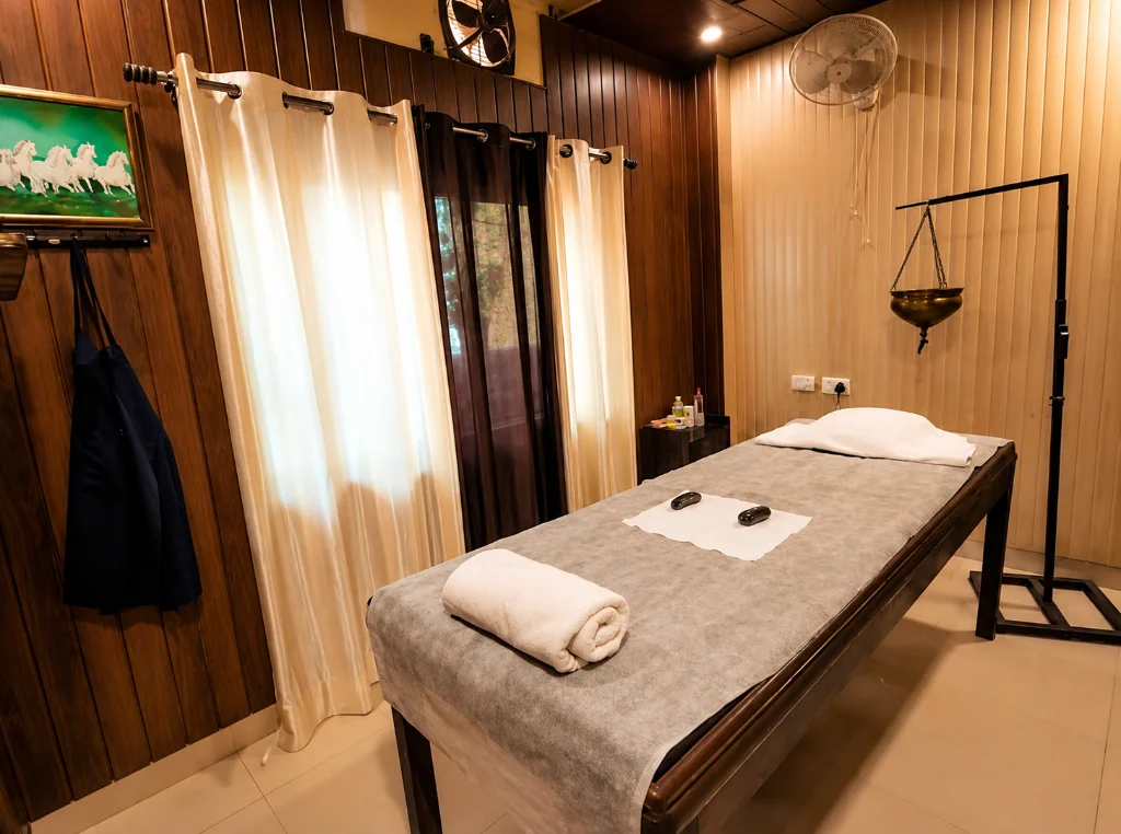 Therapy room with a massage table and shirodhara stand
