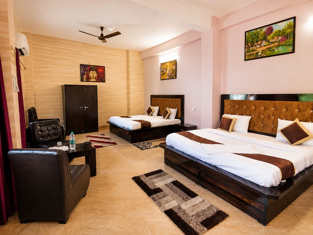 Twin-share student room with two beds, wardrobe and seating