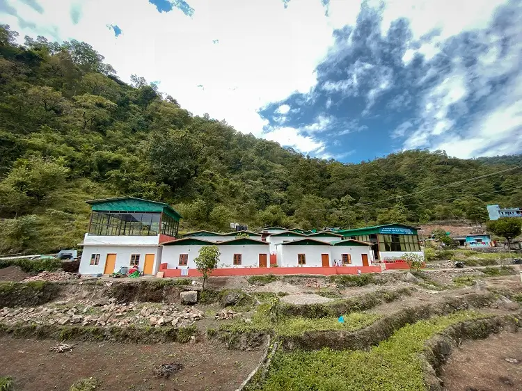 The Rishikesh Yog Kendra campus set into the forested hillside