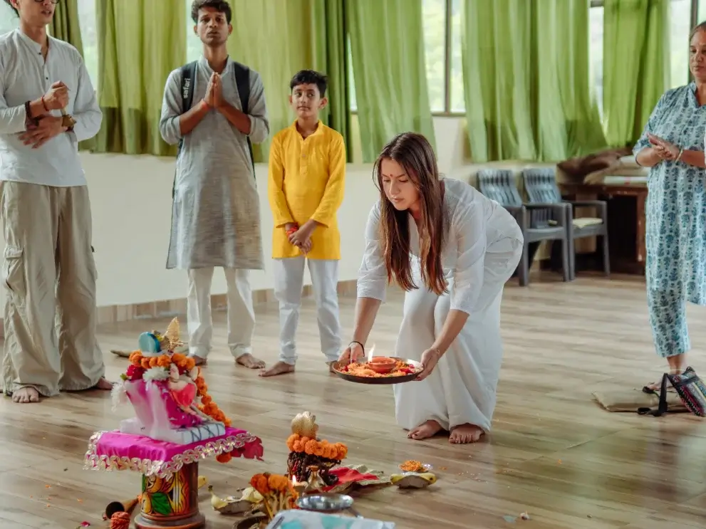 Students gathered for an opening puja ceremony at the start of a course in Rishikesh